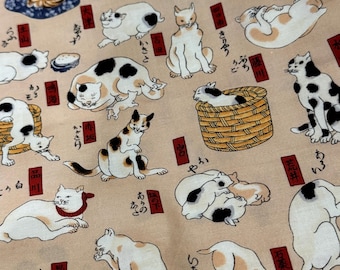 May include: Tan fabric with a repeating pattern of cats in various poses. The cats are white, black, and orange, with some wearing red collars. Japanese text and red rectangular accents are scattered throughout the design.