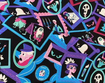 May include: A black fabric featuring a repeating pattern of framed portraits and illustrations of ghosts, skeletons, and figures in top hats. The frames are colored in shades of blue, purple, and pink, with characters in teal, white, and red.