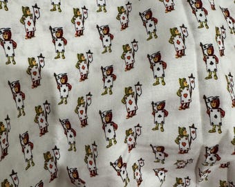 May include: White fabric with a repeating pattern of playing card figures. Each figure is dressed in red and green, holding a flag with a playing card suit symbol. The fabric is suitable for sewing projects.