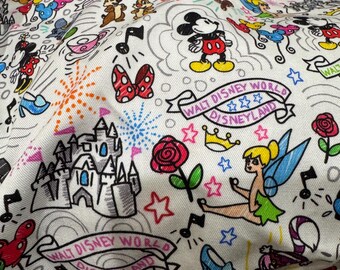 May include: A white fabric featuring a colorful repeating pattern of Disney icons including Mickey Mouse, Tinker Bell, a castle, red roses, crowns, and banners with the text Walt Disney World and Disneyland interspersed with musical notes and stars.