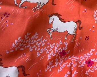 May include: An orange fabric featuring a repeating pattern of white horses with brown manes and tails. Some horses are shown with a figure in a pink dress riding on their back. The design includes small pink flowers and white leafy sprigs.