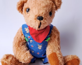 Urso de pelúcia musical vintage feito de mohair de pelo comprido. Urso de pelúcia com partituras nas costas. Enchimento de algodão. Alemão, meados do século XX, década de 1950.