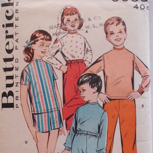 May include: Vintage Butterick sewing pattern featuring illustrations of children's sleepwear. The pattern includes designs for a striped top and shorts set, a dotted pajama set with a cap, and solid-colored pajamas. The pattern number is 9055.