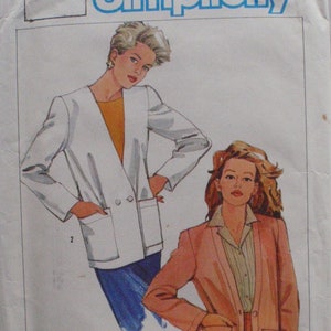 May include: A sewing pattern for two jackets. The pattern is from Simplicity and the pattern number is 6746. The pattern includes instructions for a white jacket with a double-breasted closure and a peach-coloured jacket with a single-breasted closure.