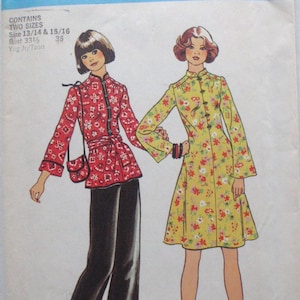 May include: A Simplicity 7356 sewing pattern envelope featuring illustrations of two outfits. One is a red floral long-sleeve top with a tie waist and black pants. The other is a yellow floral long-sleeve dress with a high collar and button front.