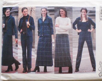 May include: A Butterick 5834 sewing pattern envelope featuring five variations of outfits including jackets, trousers, and skirts. The designs showcase dark blue plaid patterns, solid dark blue fabrics, and a cream-colored knit sweater.