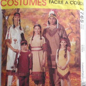 May include: A vintage sewing pattern for Native American costumes. The pattern includes four different costumes: a long dress with fringe, a shorter dress with fringe, a tunic with fringe, and a shirt with fringe. The pattern is for children's sizes.