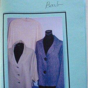 May include: Two jackets on mannequins, one is a light beige jacket with buttons and the other is a blue jacket with buttons. The image is titled "Damask Jacket" by "Barb".