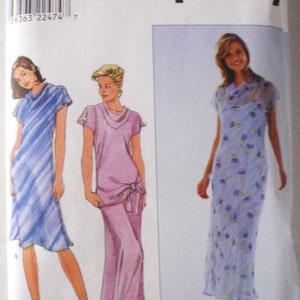 May include: Simplicity sewing pattern number 3509 for sizes 12, 14, and 16. The pattern includes three dress designs: a striped blue dress, a pink dress with a cowl neck, and a floral print dress.