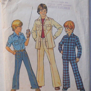 May include: A vintage Simplicity sewing pattern envelope for size 12, 30-inch chest boy's clothing. The illustration features three figures wearing button-down shirts and flared trousers, including a blue shirt with jeans and a plaid shirt set.