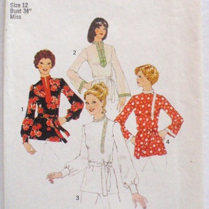 May include: A Simplicity 6815 sewing pattern envelope for size 12, bust 34 inches. The cover features illustrations of four long-sleeved tunics with tie waists, including a black floral print, a solid white design, and a red floral print.