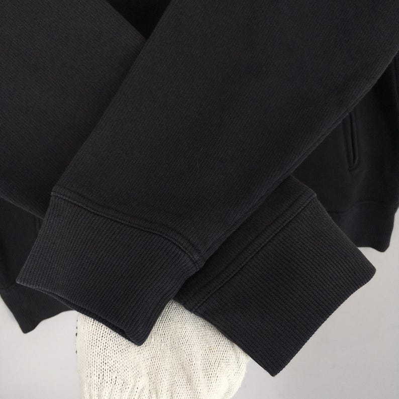 May include: A set of three ceramic mugs with a speckled, matte finish in cream, light brown, and dark brown. Each mug has a simple design and a rounded handle. Suitable for tea or coffee, these mugs offer a minimalist aesthetic.