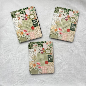 May include: Three rectangular notebooks featuring a collage of green, white, and pink patterns, including gingham, floral prints, and botanical illustrations. Each cover displays the text "HELLO SUN SHINE" and "GOOD VIBES" in a decorative font.
