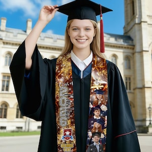 May include: A graduation sash with the text "Class of 2023 Caroline" and photos. The sash is decorated with gold sparkles and a school emblem. The person is wearing a black graduation gown and cap with a red tassel.
