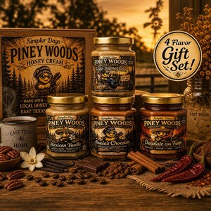 May include: A 4-flavor gift set of Piney Woods Honey Cream featuring four glass jars with gold lids, a branded box, and a mug labeled East Texas is Home. The jars are labeled Front Porch Pecan, Mexican Vanilla, Abuela's Chocolate, and Chocolate con Fuego.