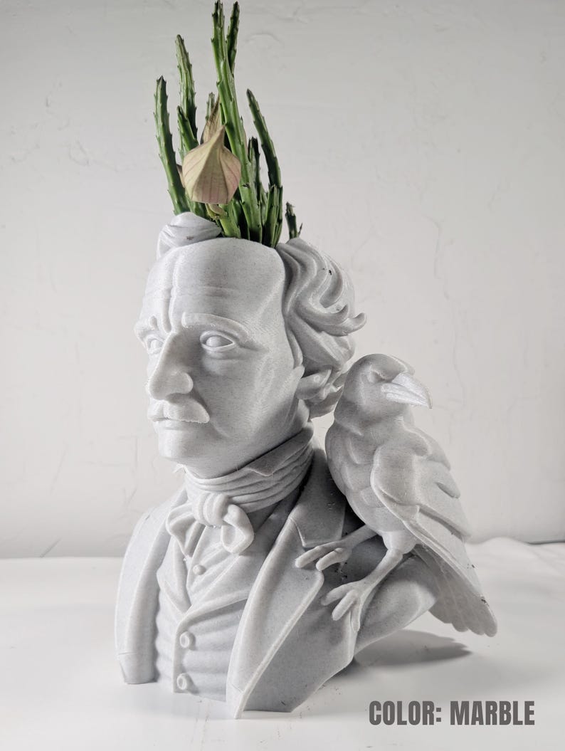 May include: Marble-effect bust of a man with a raven on his shoulder, with a plant growing from the top of his head. The bust has a textured finish. The text "COLOR: MARBLE" is at the bottom.