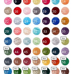 May include: A colour chart displaying 65 numbered yarn samples in a variety of shades, such as white, yellow, pink, blue, green, and brown. Each yarn ball is circular, with 'New' labels on some.