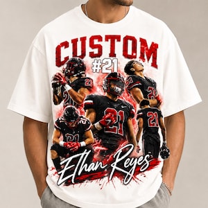 May include: A white short-sleeve t-shirt featuring a graphic print of a football player wearing a black uniform with the number 21. The design includes the text CUSTOM, #21, and the name Ethan Reyes in a script font with red lightning accents.