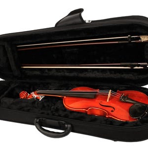 May include: A violin in a black case with a handle. The violin is a reddish-brown color and has a black fingerboard. Two violin bows are stored in the case. The interior of the case is lined with black plush material.