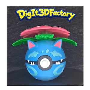 May include: A blue spherical figure with a central circular button, small white teeth, and pointed ears, topped with a large pink and green flower structure. The text DigIt3DFactory is displayed in yellow and blue letters above the object.