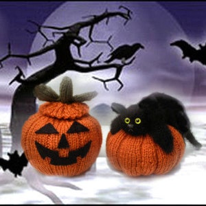 May include: Two knitted orange pumpkins with black jack-o'-lantern faces. One pumpkin has a black cat peeking out of the top.