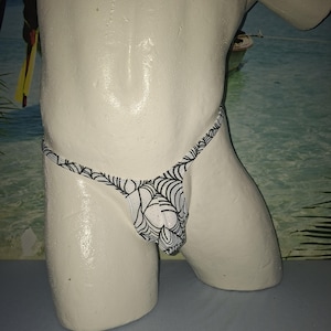 NEW!! Very nice thong with a small triangle at the buttocks and approximately 14 mm straps.