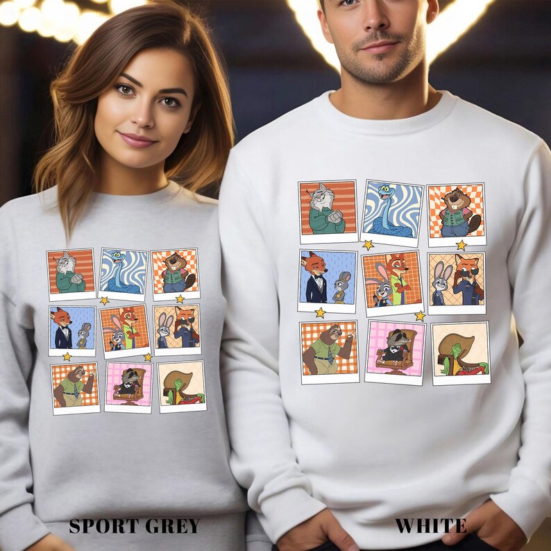 May include: Sport grey and white sweatshirts featuring a grid of cartoon character portraits. Each portrait is framed with a white border and a star. The sweatshirts have the words "SPORT GREY" and "WHITE" printed at the bottom.