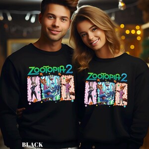 May include: Black sweatshirts featuring the text "ZOOTOPIA 2" in green and blue, with cartoon characters in colorful rectangular frames. The word "BLACK" is printed at the bottom of the sweatshirt.
