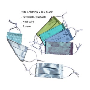 2 layers cotton + Dupioni silk holiday mask + nose wire. Reversible,reusable, washable. Adjustable straps. 2 in 1 mask aqua blue made in USA