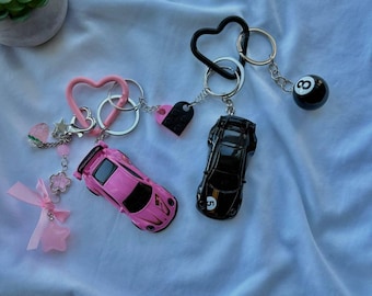 paar hotwheels porsche 911 gt3 sleutelhangers