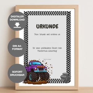 May include: A framed certificate with the German word "URKUNDE" at the top. The certificate features a purple monster truck illustration and text in German. The frame is light brown.