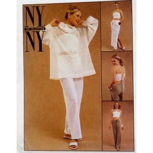 May include: A sewing pattern envelope for NY NY The Collection featuring white garments including a loose-fitting long-sleeve crochet-style top, a halter crop top with lace-up back detail, a long skirt with a side slit, and straight-leg trousers.