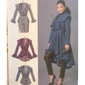 May include: A sewing pattern illustration featuring four coat designs with large ruffled collars and flared sleeves. Three sketches show variations in length and pattern, while a photograph displays a blue coat with a high-low hem and buttons.