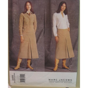 May include: A sewing pattern showing two outfits: a tan skirt suit and a tan skirt with a white top. The pattern is by Marc Jacobs for Vogue American Designer. Pattern number 2455, sizes 14-16-18.