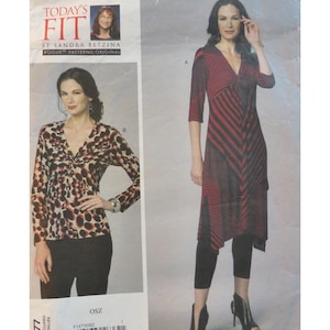 May include: A sewing pattern featuring two women's fashion designs. One design is a V-neck top with a leopard print, and the other is a long dress with red and black stripes. The pattern includes the text "TODAY'S FIT" and "VOGUE PATTERNS ORIGINAL".