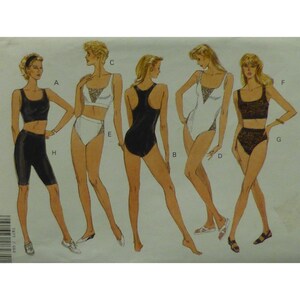 May include: A sewing pattern for five different swimsuit styles. The pattern includes a black and white swimsuit, a black swimsuit, a white swimsuit with lace trim, a black and white top with matching bottoms, and a black top with matching bottoms.