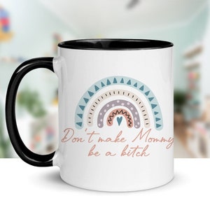 May include: White ceramic mug with a black handle and interior. The mug features a pastel rainbow design and the text "Don't make Mommy be a bitch" in a cursive font. The mug is suitable for hot or cold beverages.