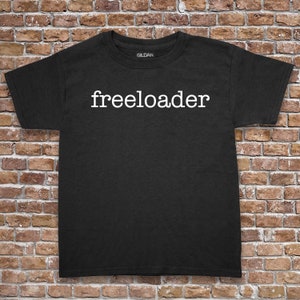 May include: Black t-shirt with the word "freeloader" printed in white on the front.
