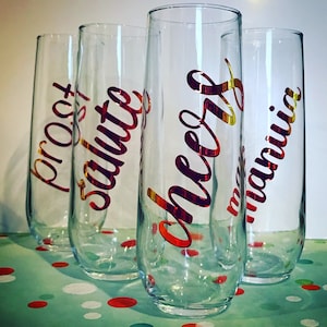 Cheers, 4 Languages, Set of 4 Stemless Champagne Glasses