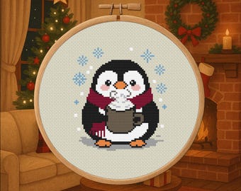 May include: Cross-stitch hoop art featuring a cute penguin with a red scarf, holding a mug of hot chocolate. The penguin is surrounded by snowflakes. The artwork is set in a cozy room with a Christmas tree and fireplace.