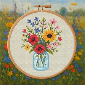 May include: Cross-stitch embroidery of a floral bouquet in a blue jar, set in a wooden hoop. The bouquet features red poppies, yellow sunflowers, pink and blue wildflowers, and green leaves. The background is a colorful meadow.