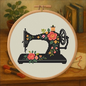 May include: Cross-stitch embroidery of a black vintage sewing machine adorned with pink and yellow flowers. The design is set within a wooden embroidery hoop, showcasing a classic craft theme. The background includes a potted plant, books, and sewing supplies.