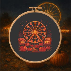 May include: Cross-stitch embroidery in a wooden hoop depicts a nighttime carnival scene. A pixelated Ferris wheel is the focal point, with food stalls and pumpkins below. The background shows a lit Ferris wheel and a dark sky.
