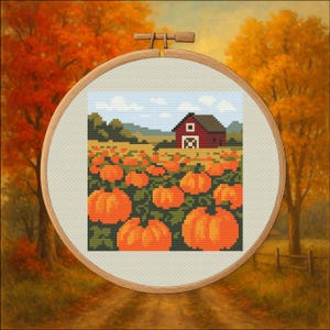 May include: Cross-stitch embroidery of a pumpkin patch with a red barn in the background. The scene is set in a wooden embroidery hoop, with a fall landscape painted around the hoop. The pumpkins are orange, and the sky is blue.