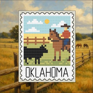 May include: A cross-stitch design featuring a cowboy on a horse, a black cow, and a wooden fence under a blue sky with clouds and a sun. The word "OKLAHOMA" is at the bottom, framed by a postage stamp border.