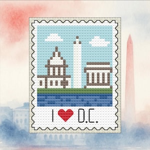 May include: Cross-stitch design featuring Washington D.C. landmarks: the Capitol Building, Washington Monument, and a monument. The design is on a postage stamp-like border with the text "I ❤️ D.C." in black and red.