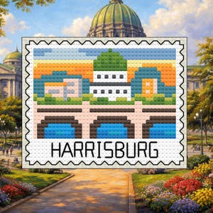 May include: A cross-stitch style image of a postage stamp with the word "HARRISBURG". The stamp shows a building with a green dome, set against orange, blue, and yellow. The stamp is framed by a white border with a decorative edge.