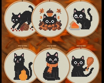 May include: Six cross-stitch embroidery hoops featuring black cats in various autumnal scenes. The cats are depicted with pumpkins, pie, and fall leaves. The hoops are displayed on a wooden surface with fall leaves.