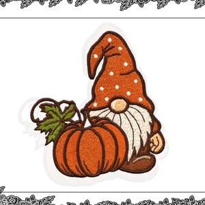 May include: An embroidered patch featuring a gnome with a white beard and an orange hat with white polka dots. The gnome is next to an orange pumpkin with a green leaf. The patch is a fall or harvest theme.