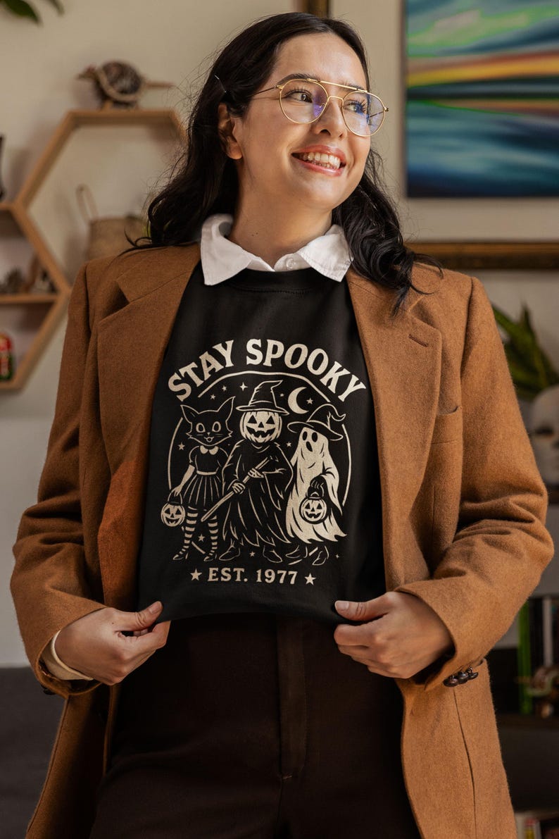 Cozy Stay Spooky Halloween sweatshirt with ghost design, women’s fall crewneck perfect for spooky season outfits and festive Halloween gifts